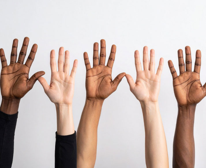 Hands raised in the air showing support for volunteer work